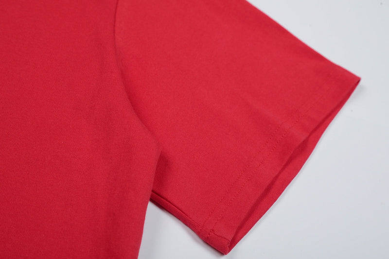 Red short sleeve graphic tee with clean hem stitching and smooth cotton fabric close-up