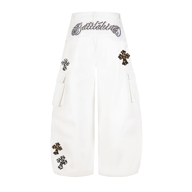 White cargo pants back view with leopard cross embroidery and script waistband detail