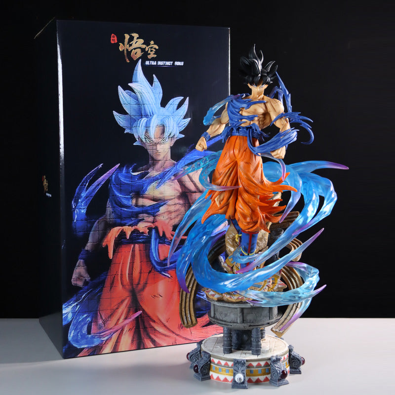 The Goku Dual Head Collectible Figure from Seakoff stands 49cm tall, featuring a character with spiky black hair and blue-orange attire on a decorative base, with a large box showcasing Dragon Ball Z artwork of Goku in Ultra Instinct form.