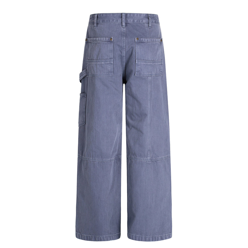 Back view of blue wide-leg carpenter pants with patch pockets and side tool loop