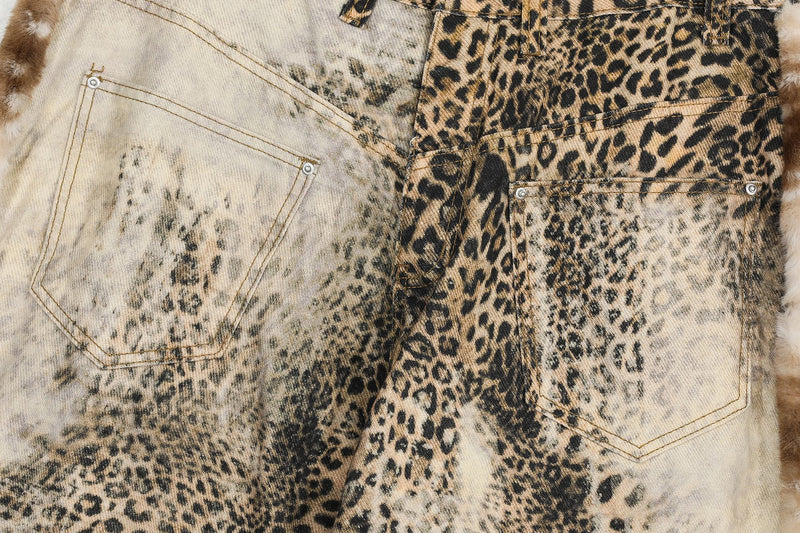 Close-up of front and back pocket stitching on leopard print jeans