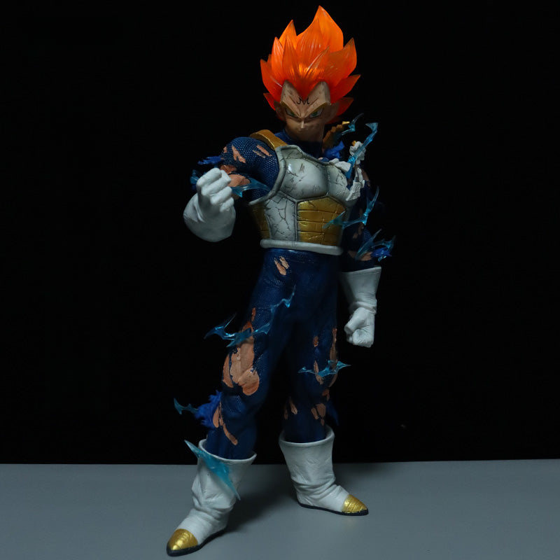 A Seakoff Vegeta Collectible Figure from Dragon Ball Z features vibrant orange hair, torn blue and white armor, and a dynamic pose with a raised fist. This Super Saiyan stands on gray against a black backdrop, capturing action essence. Comes with 4 interchangeable heads and measures 45cm.