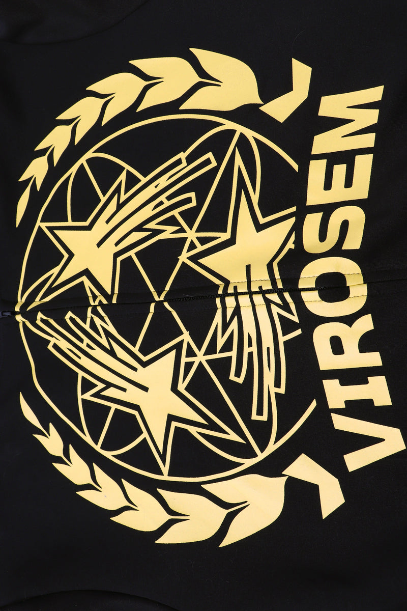 Close-up of yellow star crest graphic and Virosem text on black hoodie fabric