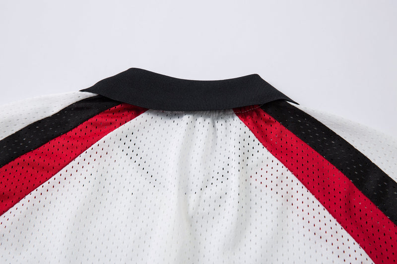 Black collar colorblock mesh polo shirt with white, red, and black shoulder panels