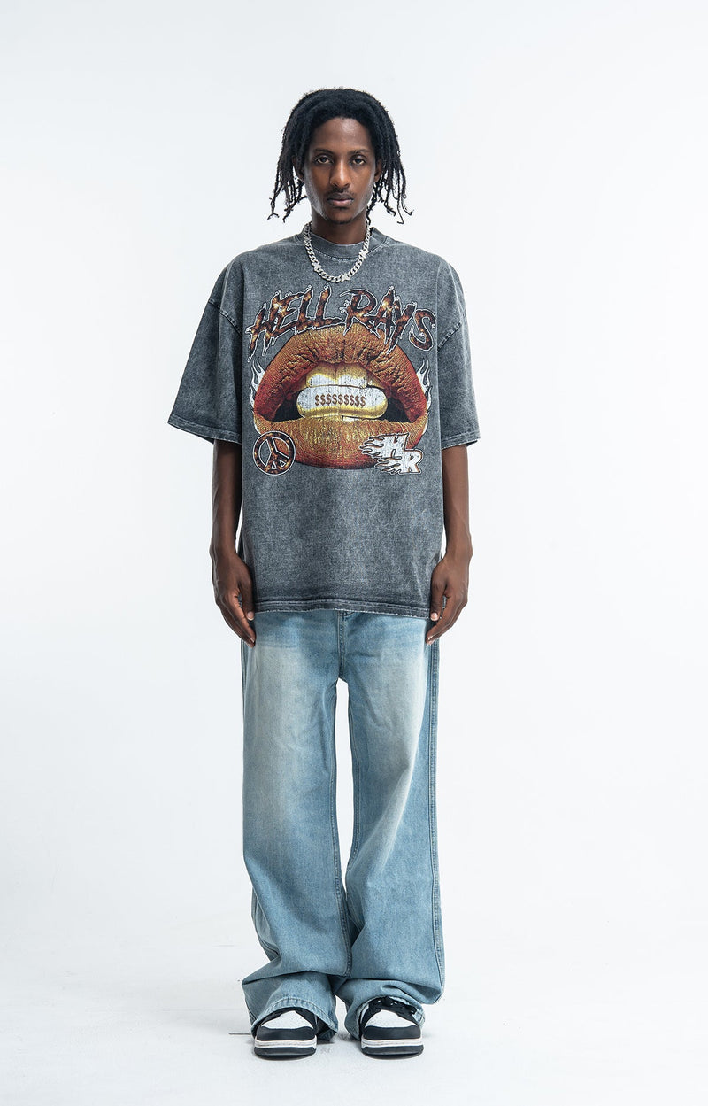 Vintage washed charcoal graphic tee with Hellrays lips print, styled with baggy light denim jeans and sneakers