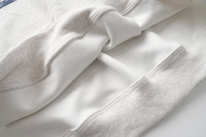 Interior view of hoodie fabric and ribbed hem seam