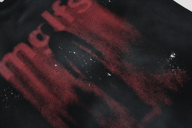 Black washed oversized tee with distressed red shadow figure graphic and speckled grunge detailing