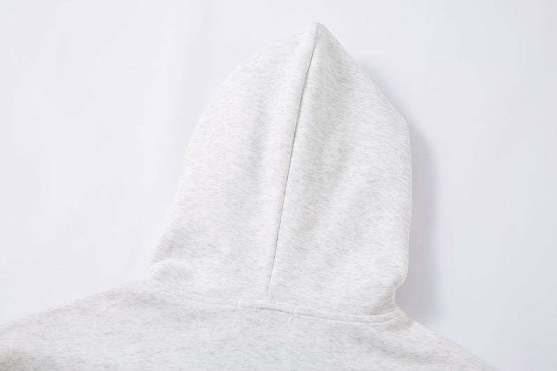 Close-up of the plain back hood on a light gray hooded jacket