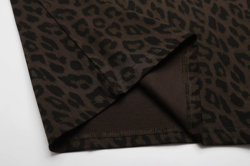 Close-up of a brown leopard print graphic T-shirt hem with visible stitching and folded fabric detail