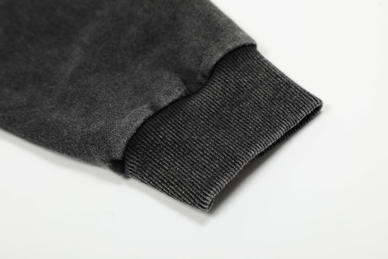 Black ribbed sleeve cuff on washed hoodie jacket