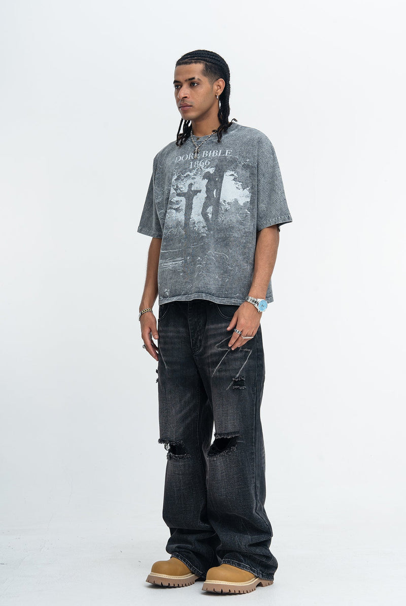 Vintage washed gray graphic tee with Doré Bible 1866 crucifixion print, styled with distressed black jeans and boots