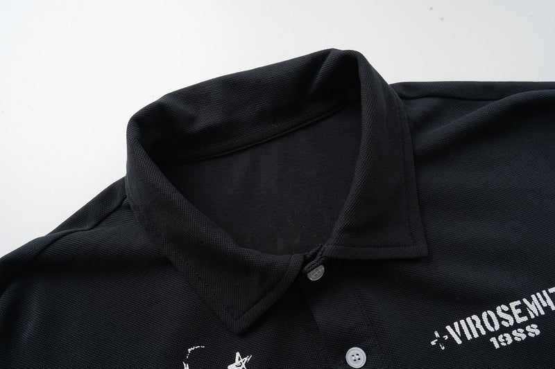 Black polo collar close-up with button placket and textured knit fabric