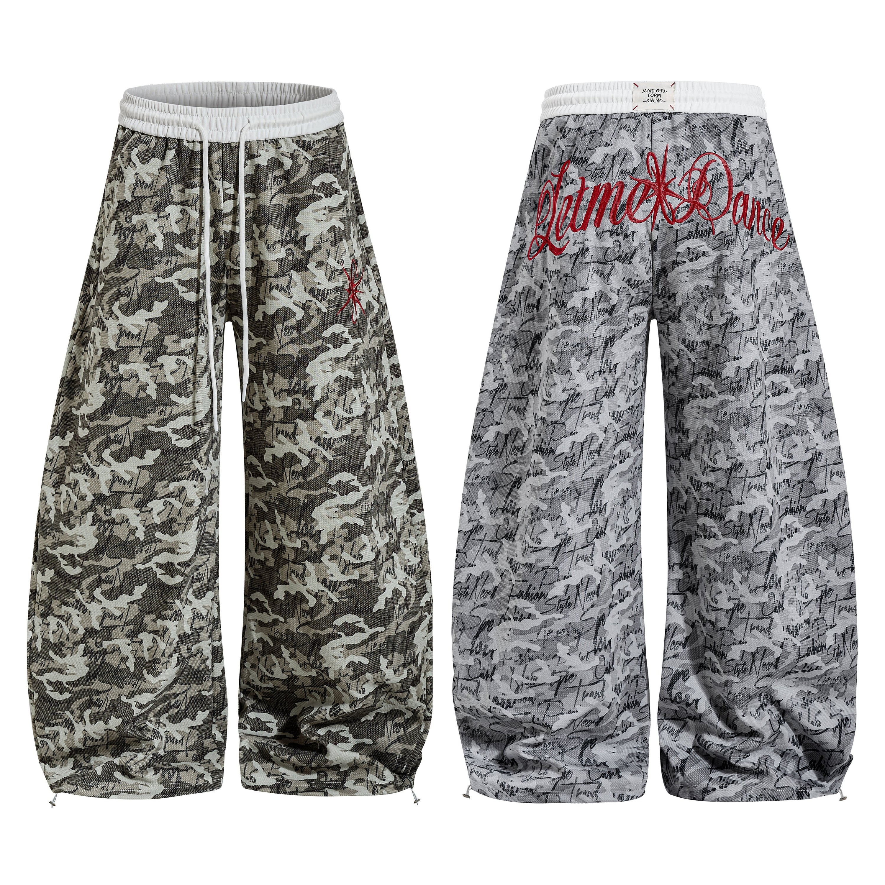 Front and back view of wide-leg camouflage pants with script print and red embroidered logo on grey waistband