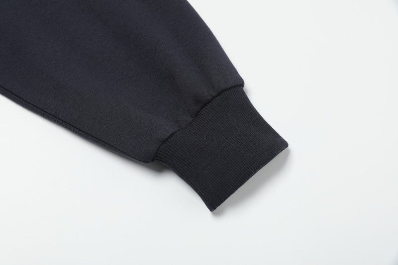 Close-up of black ribbed cuff on hoodie sleeve