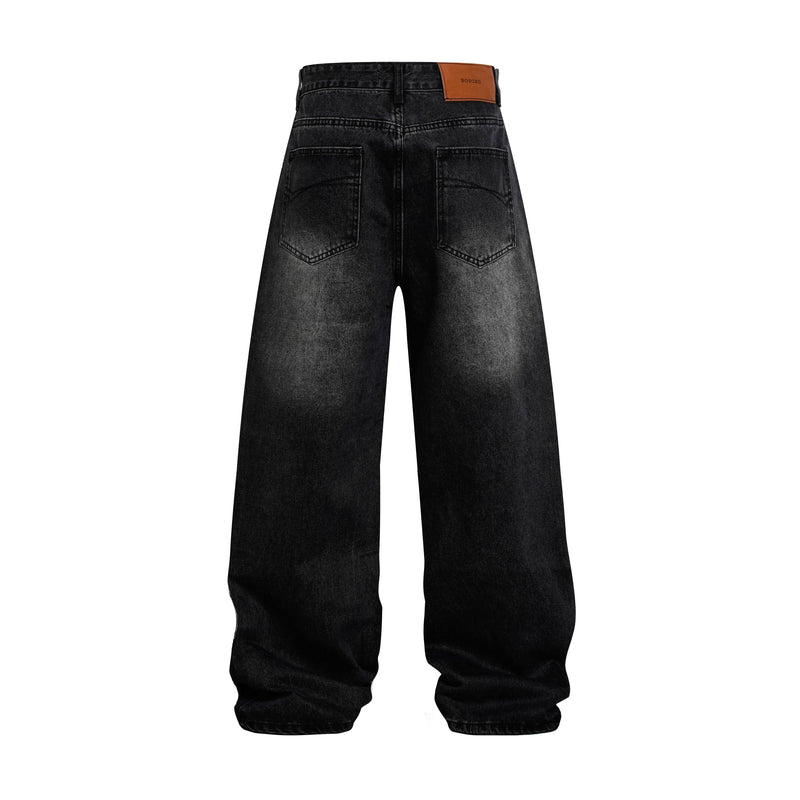 Back view of black wide-leg jeans with leather logo patch