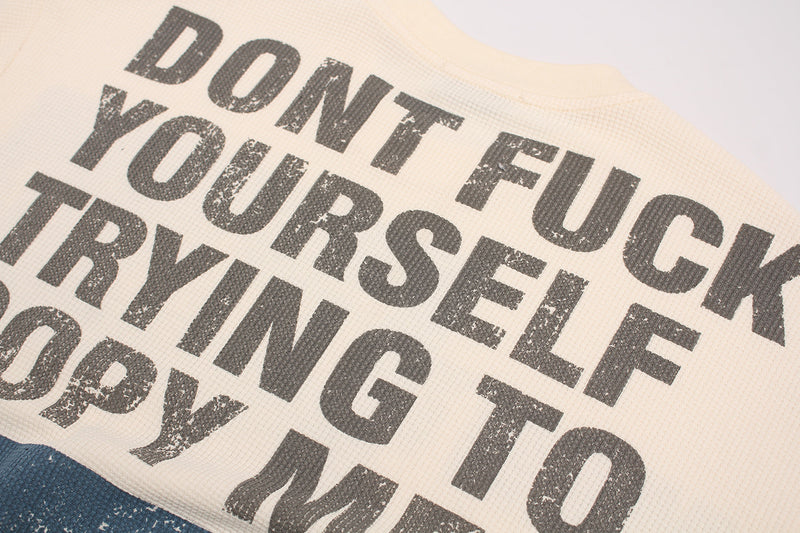 Cream waffle knit tee with bold distressed black slogan print reading Dont Fuck Yourself Tryin to Copy Me