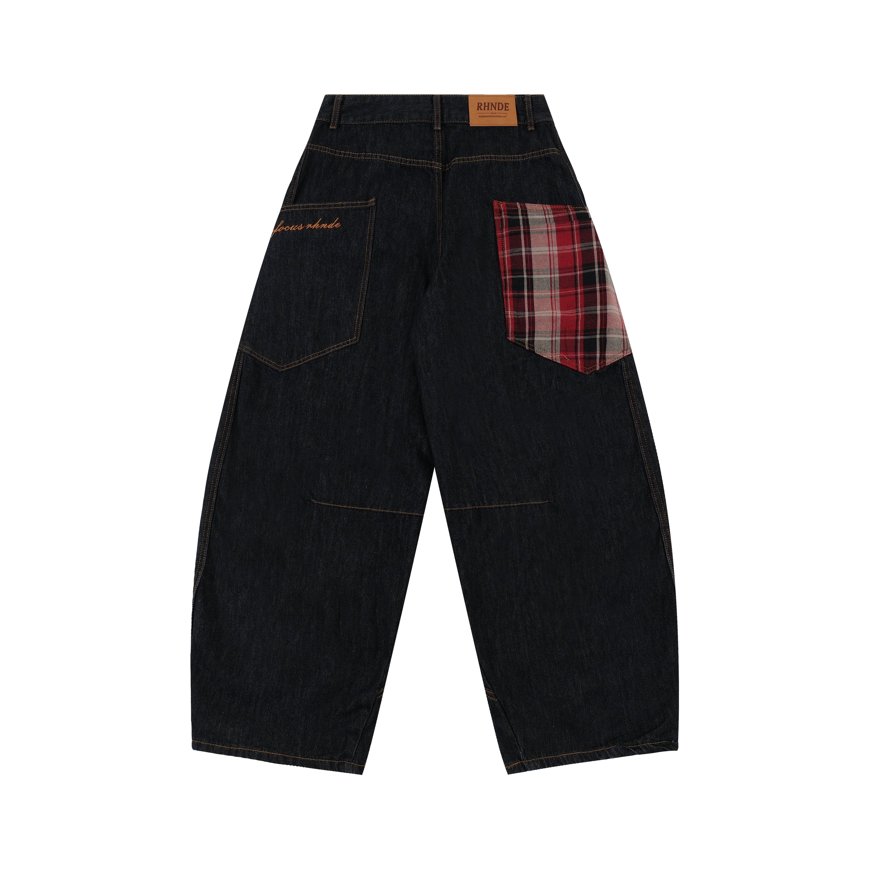 Back view of dark indigo wide-leg denim jeans with red and black plaid patch pocket and contrast orange stitching