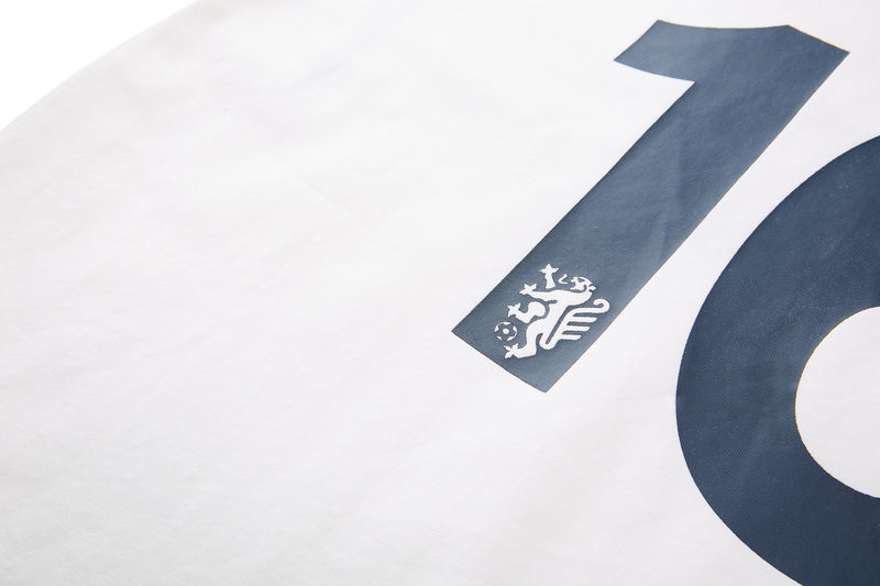 White retro football jersey tee with navy number 16 and small crest detail on the sleeve