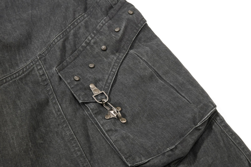 Dark gray cargo pocket detail with snap flap and metal buckle strap