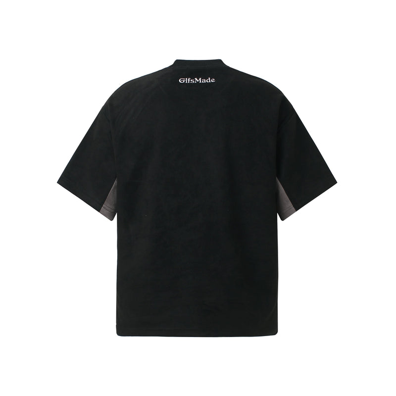Black streetwear T-shirt with oversized fit, suede-look panels, and small back logo detail