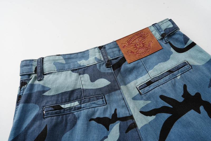 Back waist of blue camo cargo shorts with leather patch and rear pocket detail