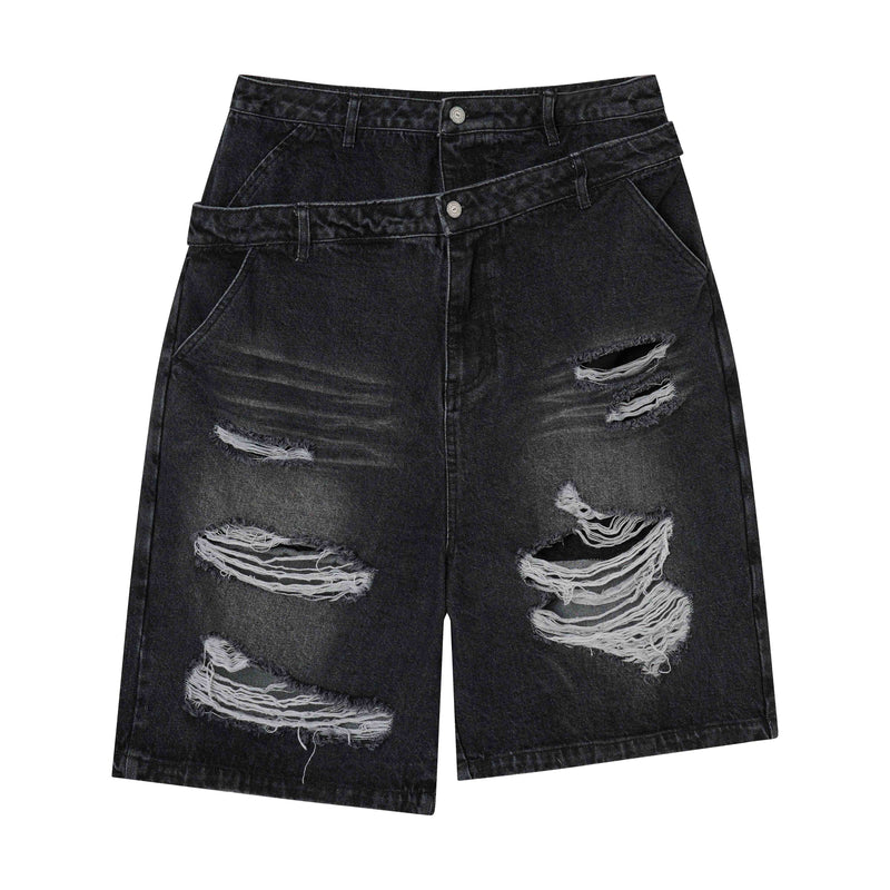 Black denim shorts with layered waistband and heavy shredded distressing on the front