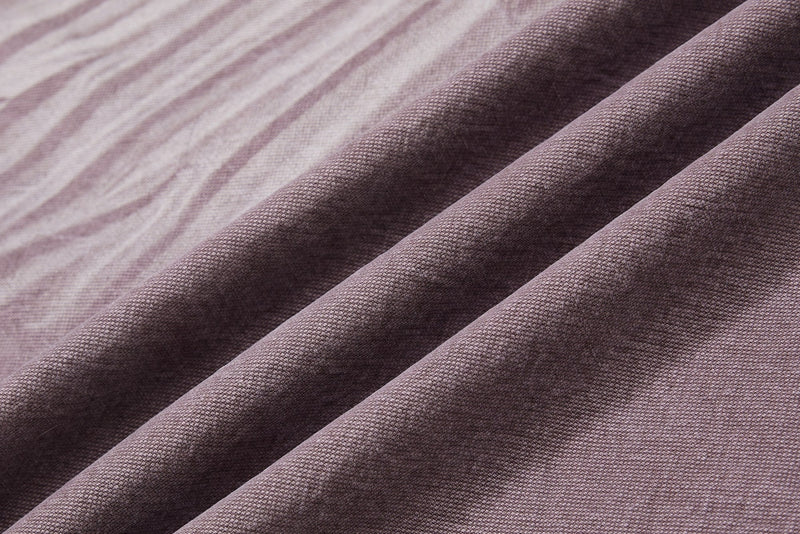 Close-up of brown denim fabric folds and texture
