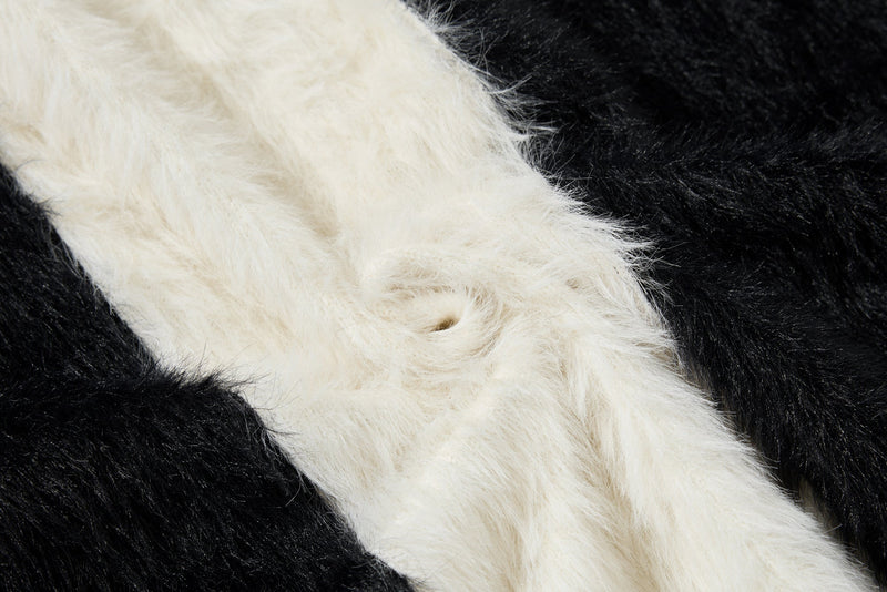 Close-up of white fuzzy stripe on black and white hoodie fabric