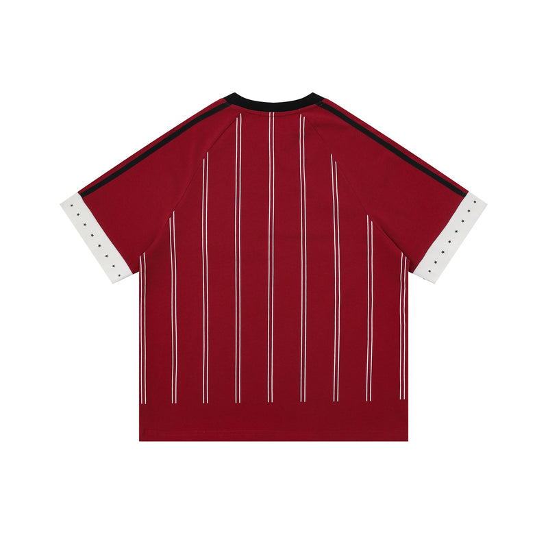 Red pinstripe sport jersey tee with black trim, white star cuff accents, and relaxed streetwear fit