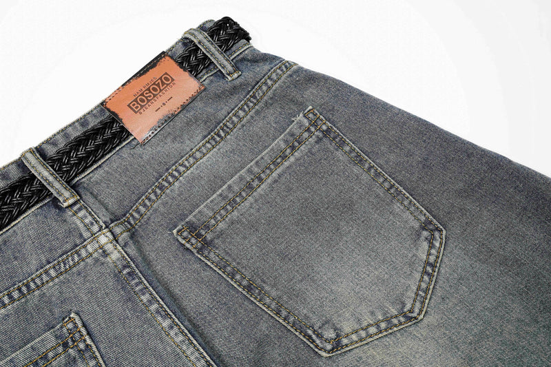 Close-up of blue jeans back pocket and brown patch label at the waistband