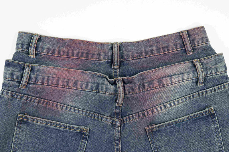 Back waistband close-up of faded wide-leg jeans with belt loops and top pockets