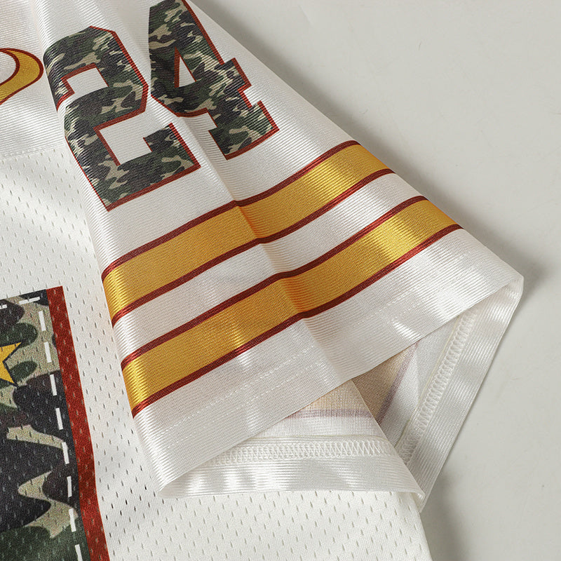 White Seakoff varsity football jersey sleeve with camo number 24 and gold-red striped cuff detail