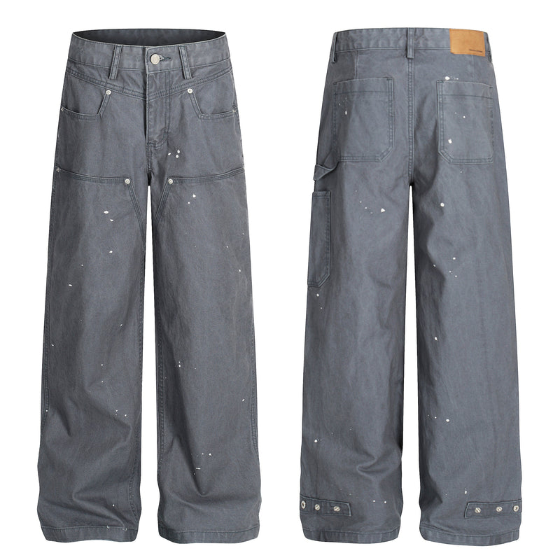 Gray wide-leg jeans shown front and back, with utility pockets and scattered white paint splatters