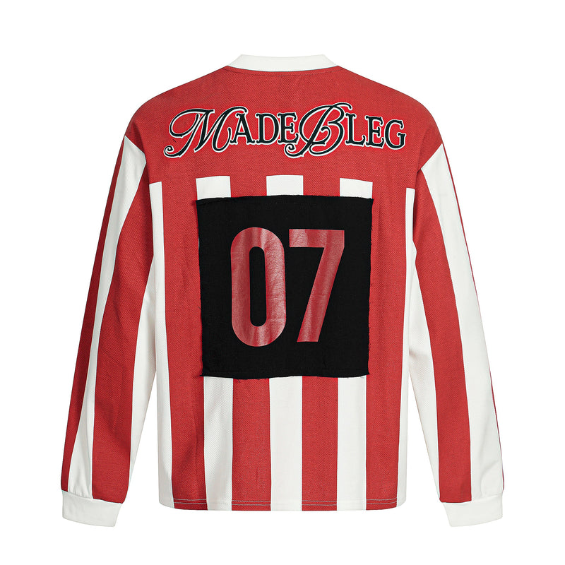 Back view of red striped long sleeve tee with MADEBLEG text and black 07 patch graphic