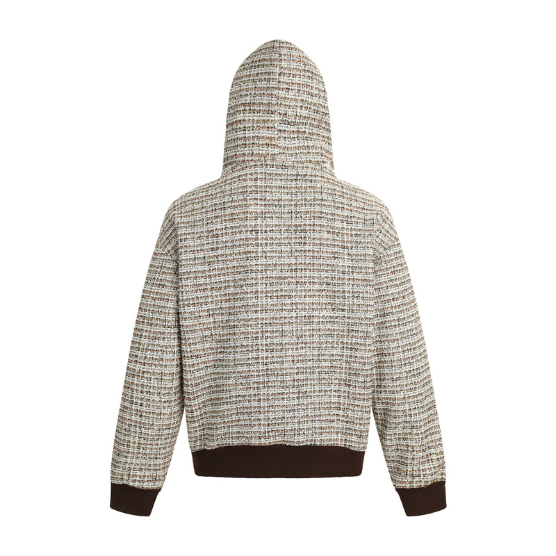 Back view of a textured boucle knit hoodie in beige and brown with dark rib trim