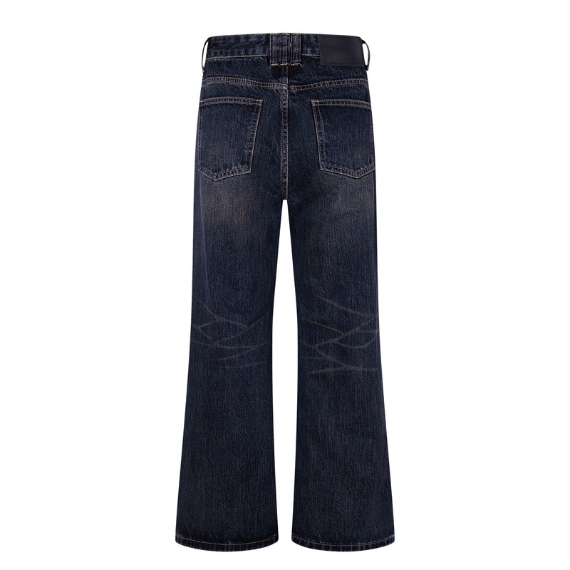 Back view of dark wash wide-leg jeans with patch pockets and leather logo label