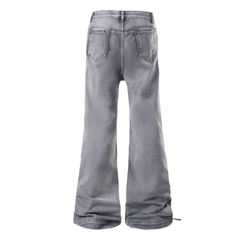 Back view of grey wash flare jeans with classic pockets and faded denim finish