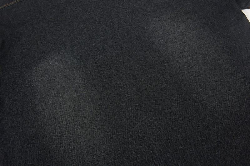 Black denim shirt fabric with a subtle washed texture and smooth streetwear look