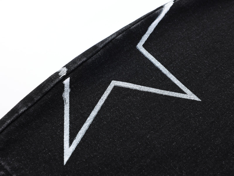 Close-up of white star outline on black denim side panel