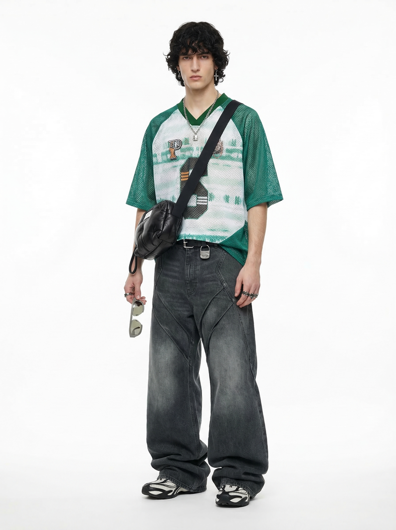 Green mesh varsity jersey T-shirt with V-neck, worn oversized with a streetwear fit and graphic front print