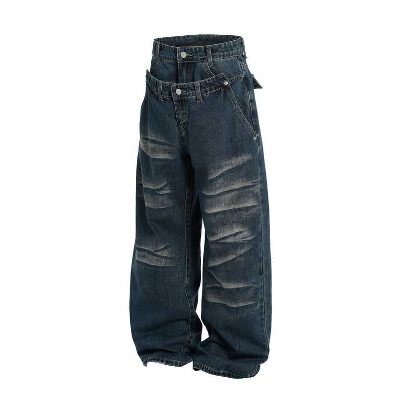 Front angled view of dark blue wide-leg jeans with double-button waist and side buckled tabs