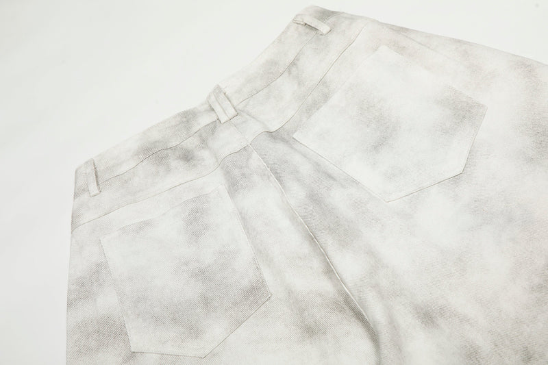Close-up of the back waistband and patch pocket on white washed cargo pants