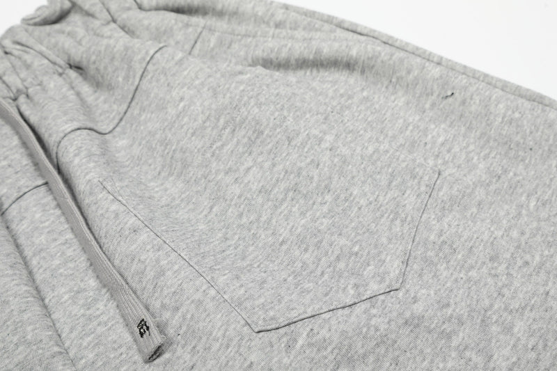 Gray back pocket detail on wide lounge shorts