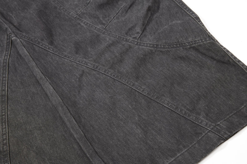 Dark gray pant leg panel detail with diagonal seam stitching