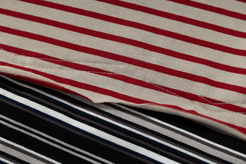 Close-up of red and beige horizontal stripes on cotton tee