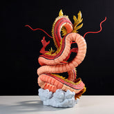 The Red Shenron Collectible Figure by Seakoff is a highly detailed Dragon Ball Z statue, featuring a 30cm coiled dragon with a fiery red and orange body, golden scales, and extended red tendrils, majestically standing atop white cloud-like formations against a black background.