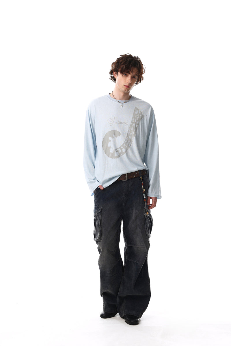 Light blue long sleeve tee worn full length with abstract front print