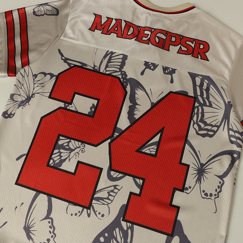 Butterfly-print varsity football jersey with red number 24 and MADEGPSR lettering on cream mesh fabric