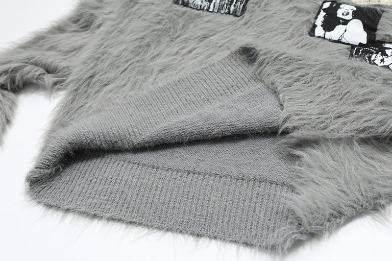 Close-up of gray sweater hem and ribbed knit trim