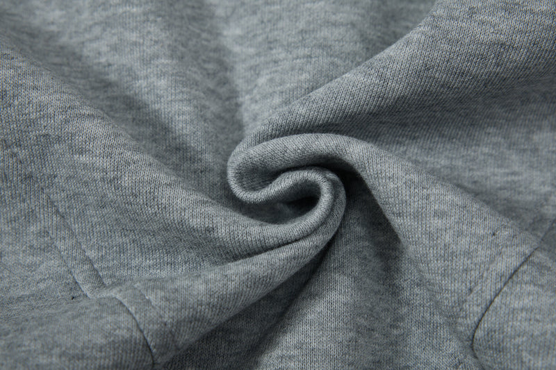 Close-up of gray hoodie fabric folded into a swirl